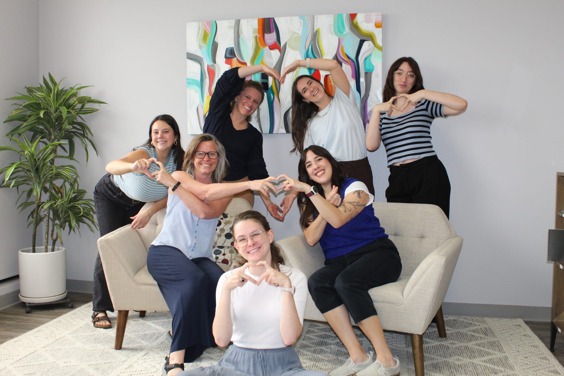 The Kemper Pelvic Physio team making heart shapes with their hands